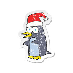 retro distressed sticker of a cartoon christmas penguin