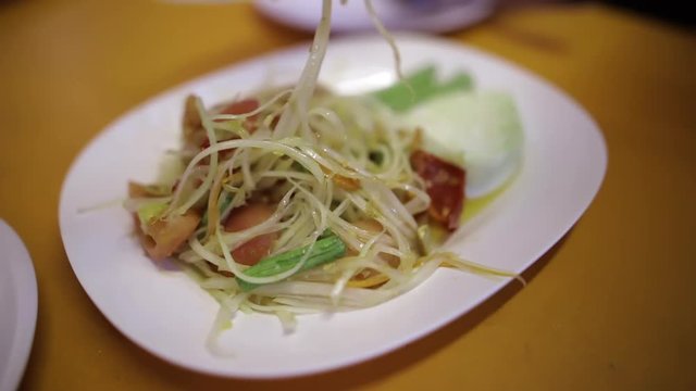 shearing somtum (thai food) )with friend.