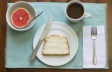Healthy breakfast on placemat on wood table