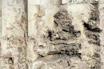 Texture of an old broken stone wall