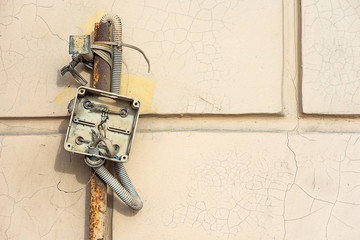 Open electrical box with wires and corrugated wire