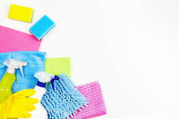 Housework, housekeeping, household, cleaning service concept. Bottles of detergent, rubber gloves, rags and sponges on white background