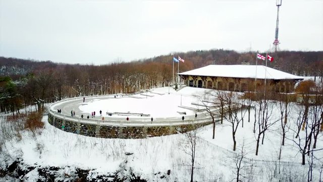 Cinematic static drone / aerial footage near mont Royal Chalet in Montreal, Quebec, Canada during winter season.