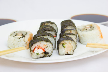 Japanese cuisine, rice sushi and fish - closeup