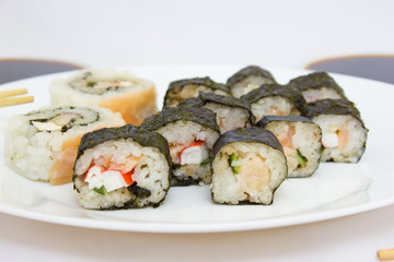 Japanese cuisine, rice sushi and fish - closeup
