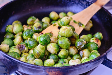 Delicious and healthy brussels sprouts is frying  in pan