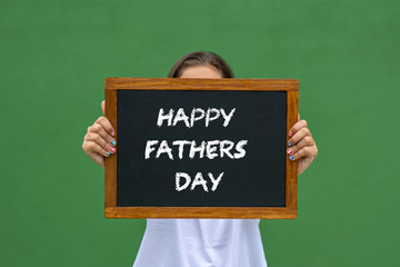 Happy Fathers Day written on the blackboard