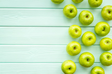 food pattern with green apples on light wooden background top view space for text