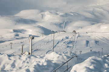 Hlidarfjall ski areal resort overlooking Akureyri in northern Iceland in the winter with a lot of...