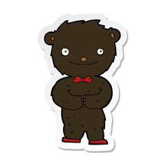 sticker of a cartoon little black bear