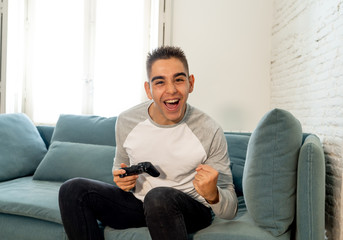 Close up portrait of young man playing video game having fun, In video game addiction or leisure