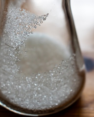 Single crystals distinctly visible in erlenmeyer flask