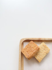 Crispy Bread Butter Sugar on wooden tray on white background.