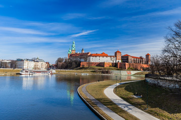 Fototapeta premium Wawel Royal Castle seen from the Debnicki Bridge. Blue sky and cloud. February 23, 2019.