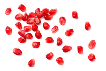 pomegranate seeds isolated on white background. top view
