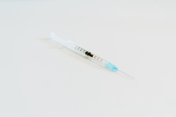 Syringe prepared for administration of the vaccine.