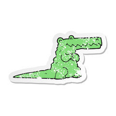 distressed sticker of a cartoon crocodile