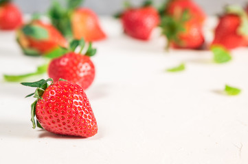 Heap of fresh strawberries on wooden table