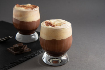Coffee affogato with vanilla ice cream and espresso. Glass with coffee drink and icecream. Copy space.