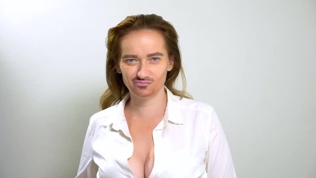 androgynous feminists with a painted mustache on her face.