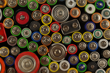Dozens of types, sizes, colors of used batteries and accumulators. Preparations for recycling or utilization.