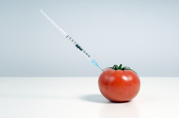 GMOs. Unhealthy food. Fruits and vegetables stuffed with chemistry.