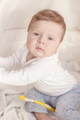 Portrait of joyfil, happiness baby in the bedroom, blurred background