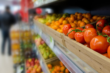 Fruits and vegetables on shelves in supermarket. Selected focus