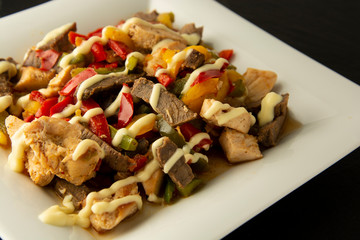Fry meat with vegetables on stone slate plates. Dinner. Delicious lunch. Assian, chinese food. Healthy food.