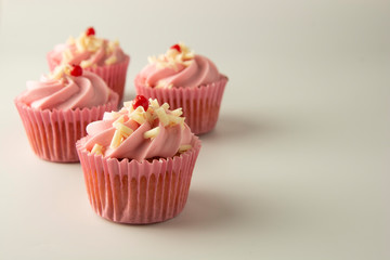 Pink, strawbery, fruit cupcakes isoalted. Sweet dessert, shortcakes with cream. Birthday food, cake, muffin.