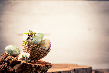Easter eggs with flower decoration over old grungde background