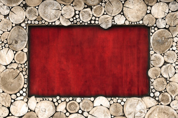 Wooden frame of sawn wood brown color on a red background