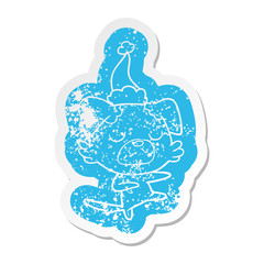 cartoon distressed sticker of a dog wearing santa hat