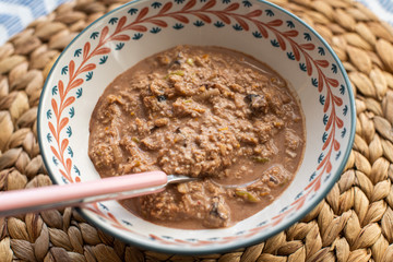 overnight oats with orange, apple, cocoa and dried plums