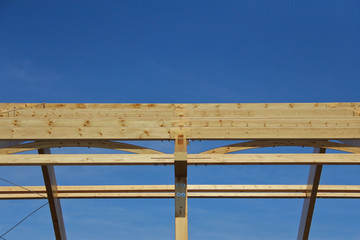The frame of the building of laminated veneer lumber. Roof construction of laminated veneer lumber. Building. Glued laminated timber.