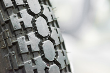 Close-up shot of classical motorcycle tire tread. Close-up protector of tire - wheel service