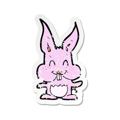retro distressed sticker of a cartoon rabbit