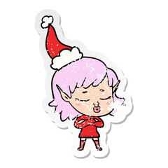 pretty distressed sticker cartoon of a elf girl wearing santa hat
