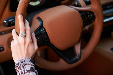 Woman driving car, Hand hold steering wheel, close-up