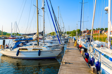 SEEDORF PORT, RUGEN ISLAND - MAY 27, 2018: Sailing boats anchoring in beautiful marina on coast of Rugen island, Baltic Sea, Germany. It is very popular tourist destination in summer season.