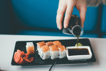 filling soy sauce to the cup