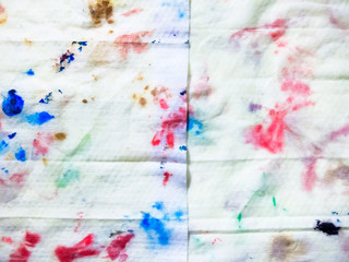 The cloth dirty after cleaning the brush, random colorful pattern on white textured background