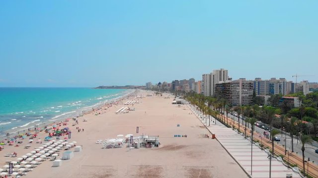 Wide aerial footage of the San Juan beachfront in Alicante, Spain