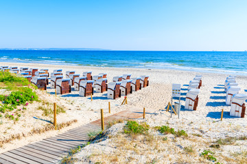 Path to beach with traditional wicker chairs in Binz summer resort, Ruegen island, Baltic Sea, Germany - obrazy, fototapety, plakaty