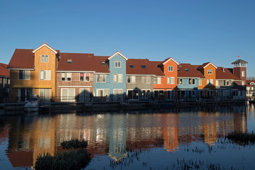 Fototapeta na wymiar Colourful waterfront houses at the Reitdiephaven (Reitdiep Marina) in Groningen, the Netherlands.