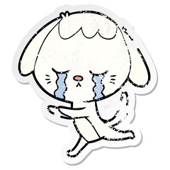 distressed sticker of a cartoon crying dog