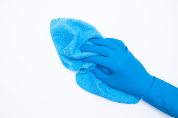 woman hand in blue rubber gloves holds rag on white background. cleaning and regular clean up concept. Top view. flat lay. copyspase
