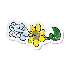 retro distressed sticker of a cartoon flower squirting water