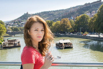 girl with sunglasses on the bridge