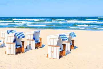Beach chairs on sea coast near Baabe village on Rugen island, Baltic Sea, Germany